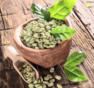 Green coffee beans with spoon